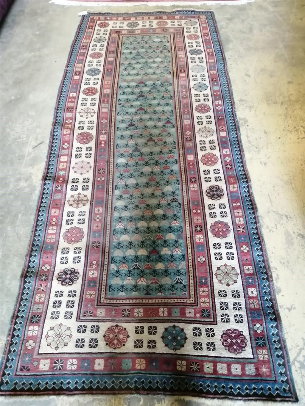 An early 20th century Caucasian hall carpet, 262 x 106cm